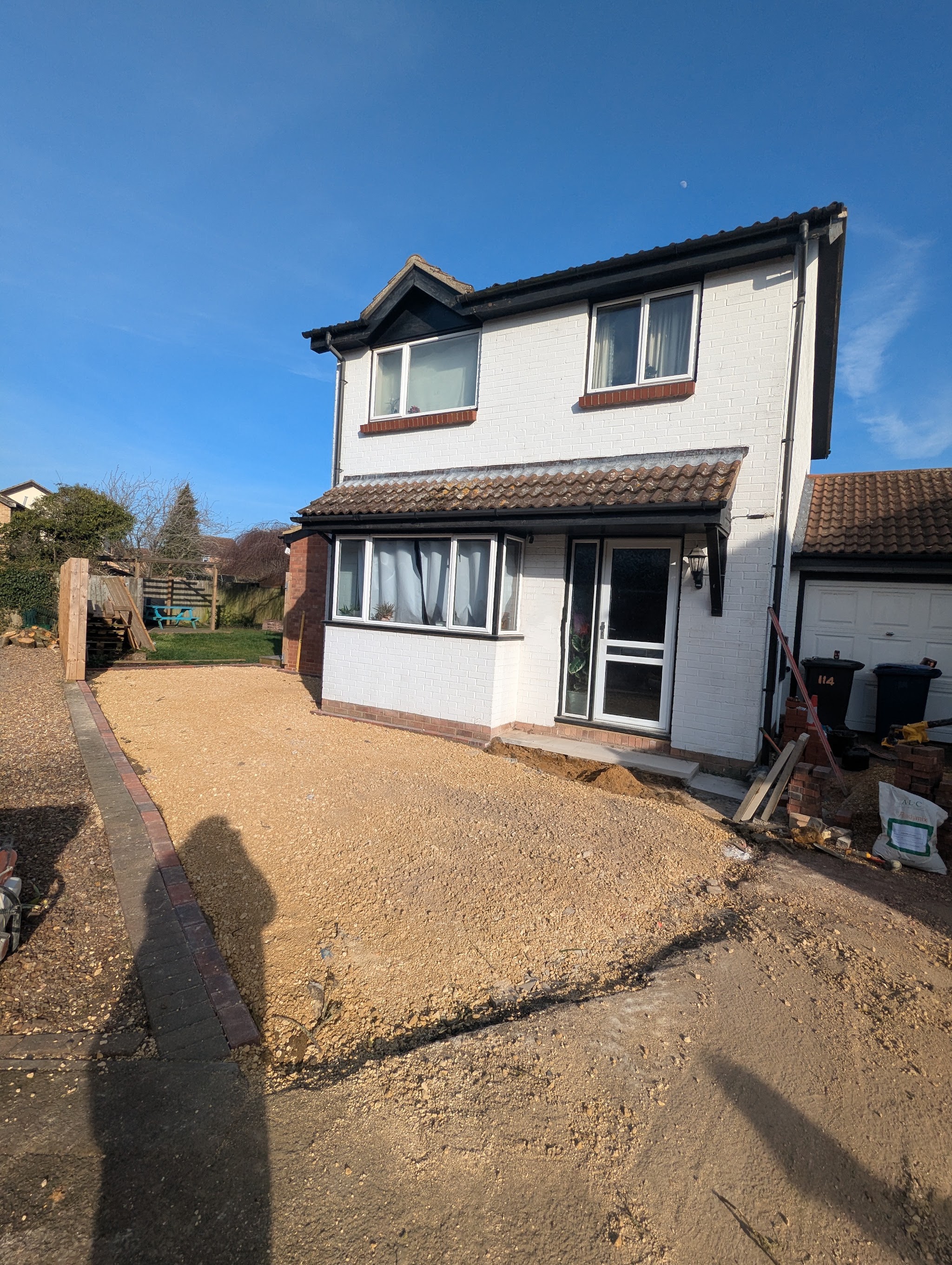 The same front garden dug out and prepared with a compacted base, ready for the new drive